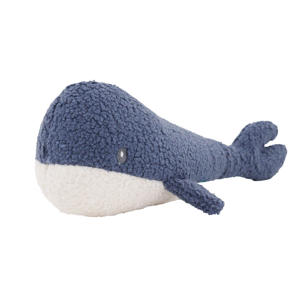 Blue plush whale toy on a white background