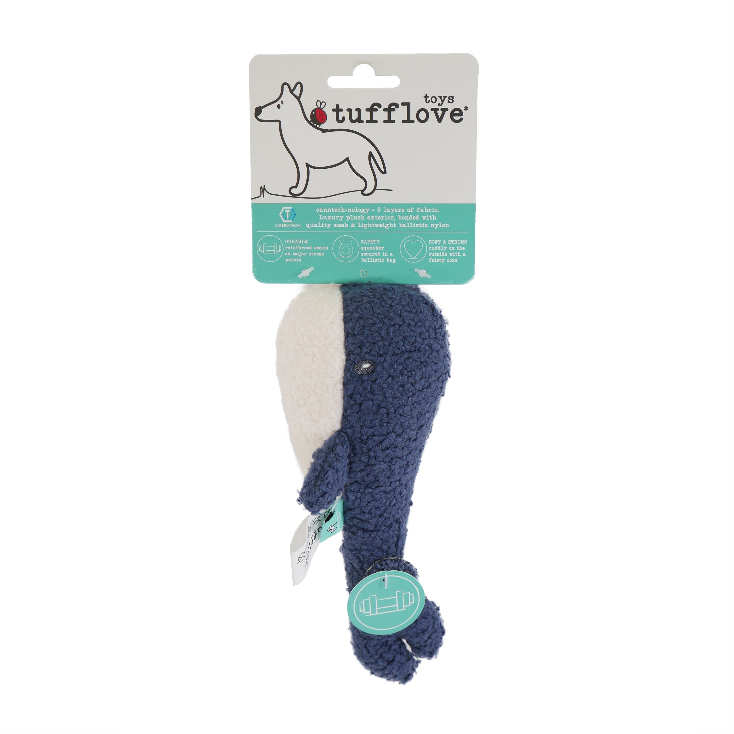 Blue and white whale-shaped dog toy with Tuff Love packaging on a white background